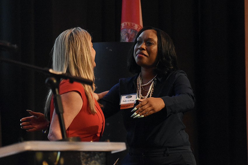 Heather Kasten greets DeAnna King of King HR Services Inc., recipient of the Breakthrough Business of the Year award.