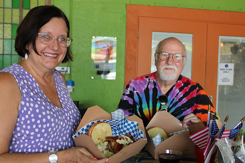 Karen Donahue and Jim Donahue celebrate Hot Dog Day with Hamlet's cheeseburgers instead.