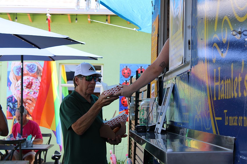 Attendees were sure to grab a hot dog from Hamlet's Eatery on their annual Hot Dog Day event.