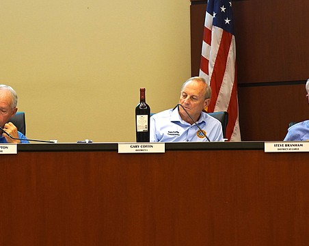 Town Commissioner Gary Coffin brought a bottle of wine to Monday's special meeting to help provide context to what a potential increase in Longboat Key millage rate would mean to a property owner.