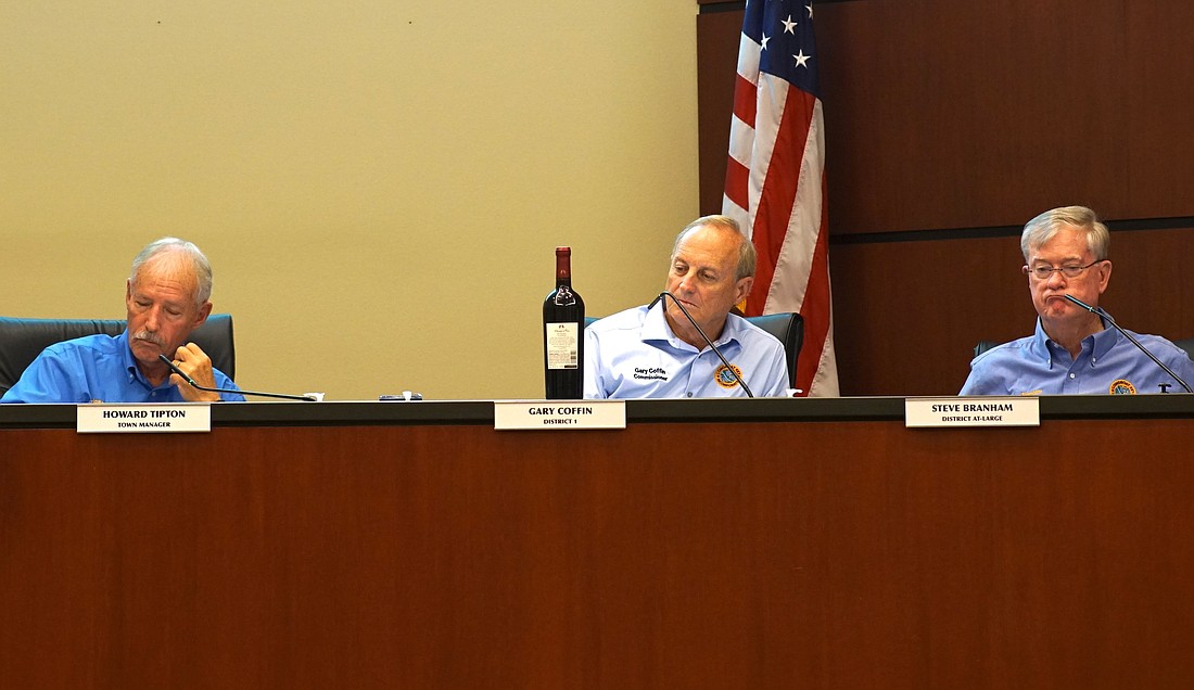 Town Commissioner Gary Coffin brought a bottle of wine to Monday's special meeting to help provide context to what a potential increase in Longboat Key millage rate would mean to a property owner.