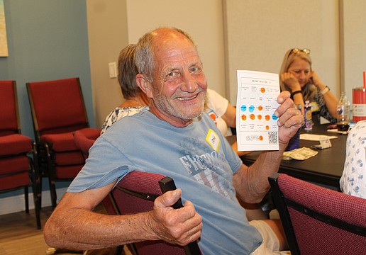 Gregg Vesta became the round one winner at the introduction of "singo" on June 29 at The Paradise Center. The game is a musical twist on bingo, prompting players to listen to a song snippet and mark its title on the card. The evening was a fundraiser to support the center's summer programs.