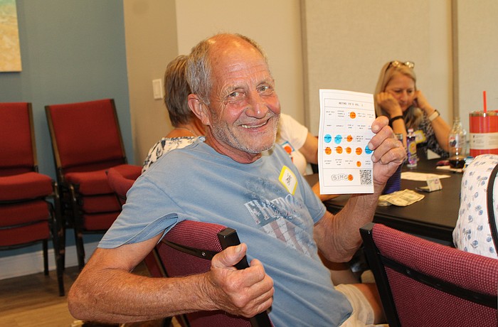 Gregg Vesta became the round one winner at the introduction of "singo" on June 29 at The Paradise Center. The game is a musical twist on bingo, prompting players to listen to a song snippet and mark its title on the card. The evening was a fundraiser to support the center's summer programs.