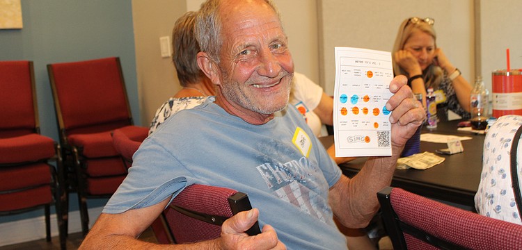 Gregg Vesta became the round one winner at the introduction of "singo" on June 29 at The Paradise Center. The game is a musical twist on bingo, prompting players to listen to a song snippet and mark its title on the card. The evening was a fundraiser to support the center's summer programs.