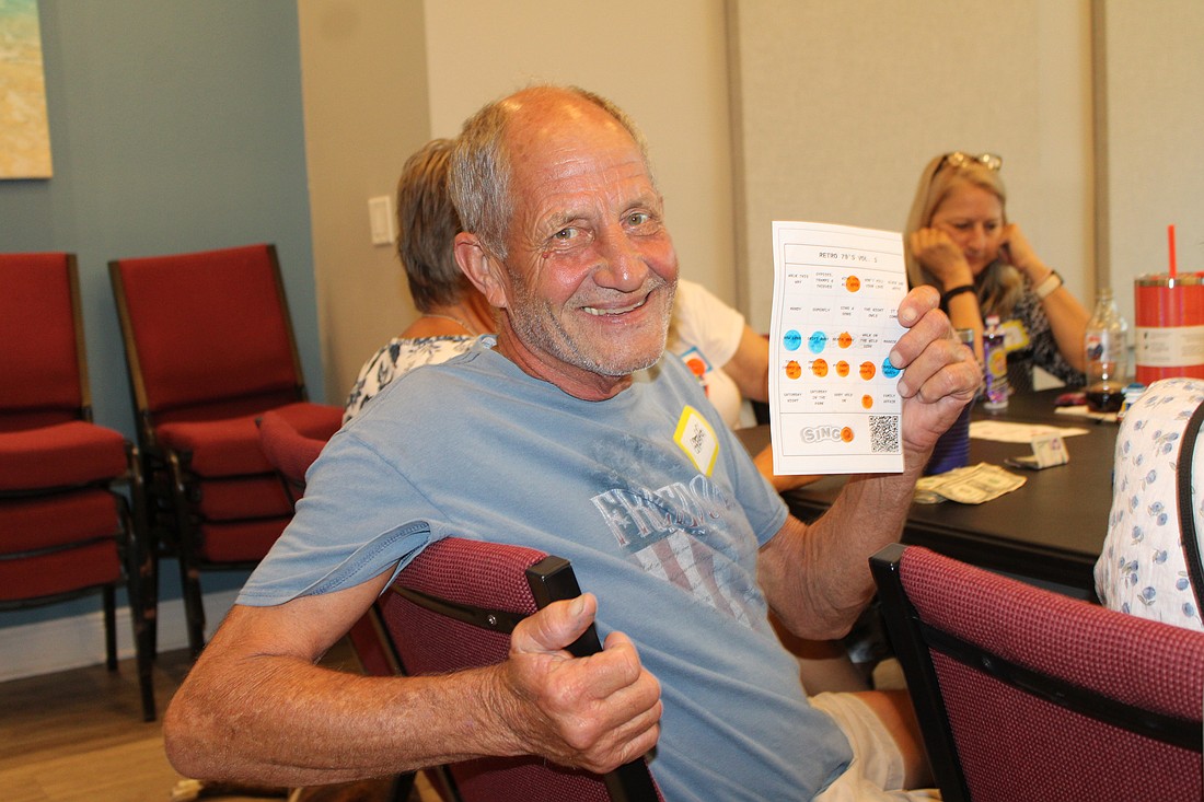 Gregg Vesta became the round one winner at the introduction of "singo" on June 29 at The Paradise Center. The game is a musical twist on bingo, prompting players to listen to a song snippet and mark its title on the card. The evening was a fundraiser to support the center's summer programs.