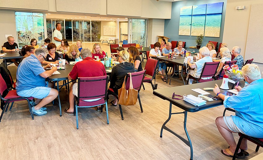 Shook Hall was packed as community members turned out for a game night to support The Paradise Center on June 29. Experienced bingo caller Reneé Fannin gave out the music cues for 'singo.'