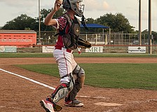Henry D'Hondt, catcher for the Sarasota Little League 12U American All-Stars, gets out of his stance for a throw. He was one of several players impacted by the October 2025 report of over $200,000 lost from the league's treasury.