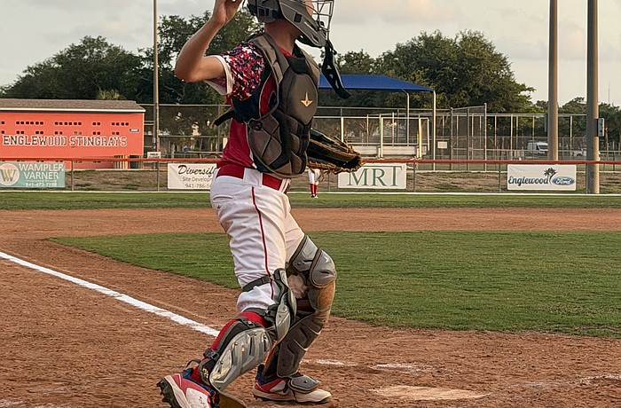 Henry D'Hondt, catcher for the Sarasota Little League 12U American All-Stars, gets out of his stance for a throw. He was one of several players impacted by the October 2025 report of over $200,000 lost from the league's treasury.