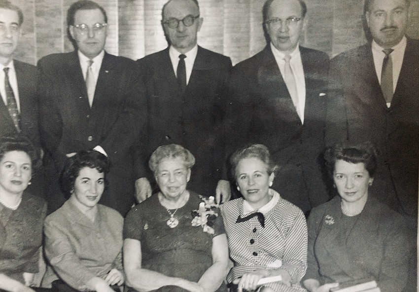 Sylvia Waller (left of front-center), with her husband Sidney Waller standing behind her, meets Eleanor Roosevelt (front center), during an event at which Sylvia Waller was honored for her work with the Red Cross. Sylvia Waller (left of front-center), with her husband Sidney Waller standing behind her, meets Eleanor Roosevelt (front center), during an event at which Sylvia Waller was honored for her work with the Red Cross.