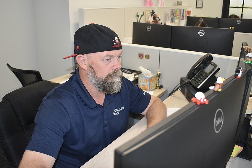 Ben Pieper works at his desk at Veteran Affairs Law.