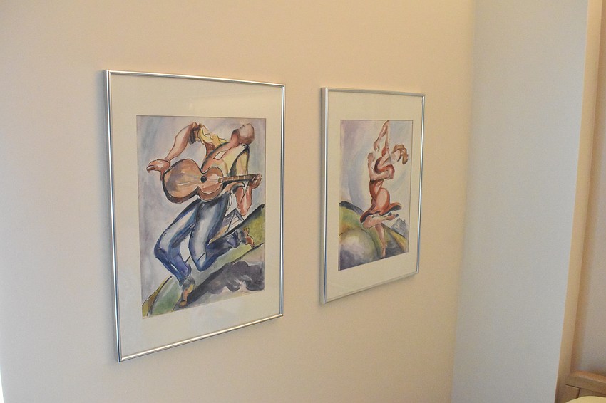 Artwork by Sylvia Waller is displayed on the wall of her Glenridge unit.