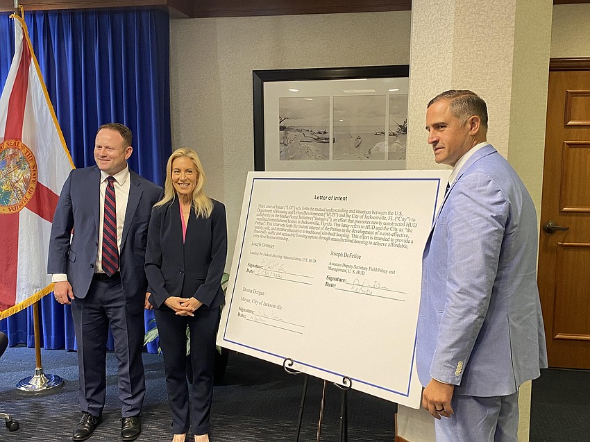 From left: Paul Olin, acting general deputy assistant secretary of the Federal Housing Administration; Jacksonville Mayor Donna Deegan; and Joseph DeFelice, HUD assistant deputy secretary for Field Policy and Management, after ceremonially signing an agreement June 30 to partner on a manufactured home affordable housing pilot in Northwest Jacksonville.