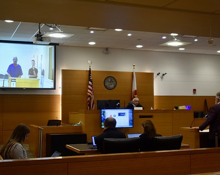 Tony Barrett appears before Judge Gilbert A. Smith Jr. July 1. He's on the screen. His attorney Richard Reinhart appeared in person.