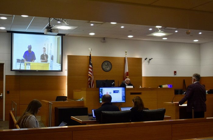 Tony Barrett appears before Judge Gilbert A. Smith Jr. July 1. He's on the screen. His attorney Richard Reinhart appeared in person.