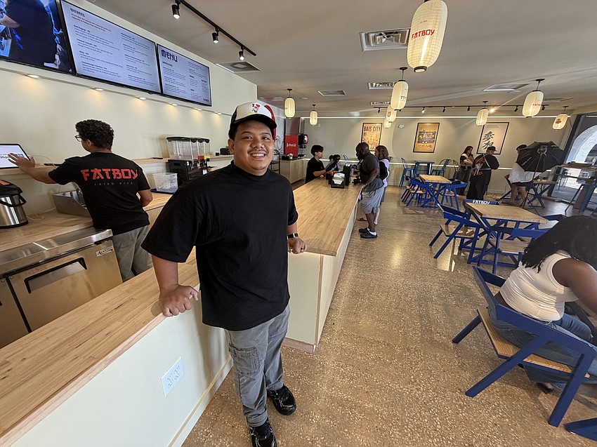 Co-owner Joshua Valencia in the dining room of Fatboy Fried Rice, which seats about 50 at its first brick-and-mortar location. Valencia and his two partners saved $16,000 to buy their first food truck before expanding to a restaurant.
