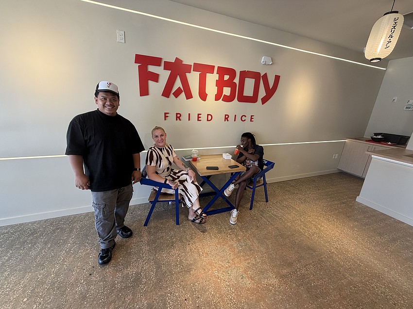 Co-owner Joshua Valencia visits with customers during a friends-and-family preview event June 29 at Fatboy Fried Rice, which grew from a backyard food operation in 2021 to four food trucks before opening its first restaurant.