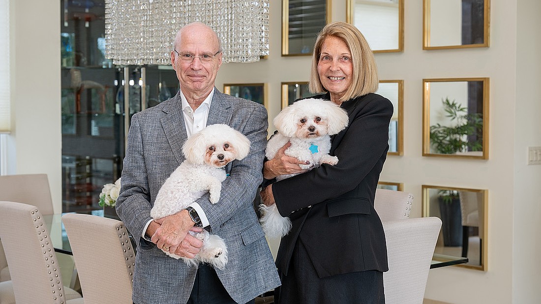 Drs. Joel and Gail Morganroth could often be seen doting on their dogs, Brandy and Bentley. The couple is pictured here at their Siesta Key home in early 2025.