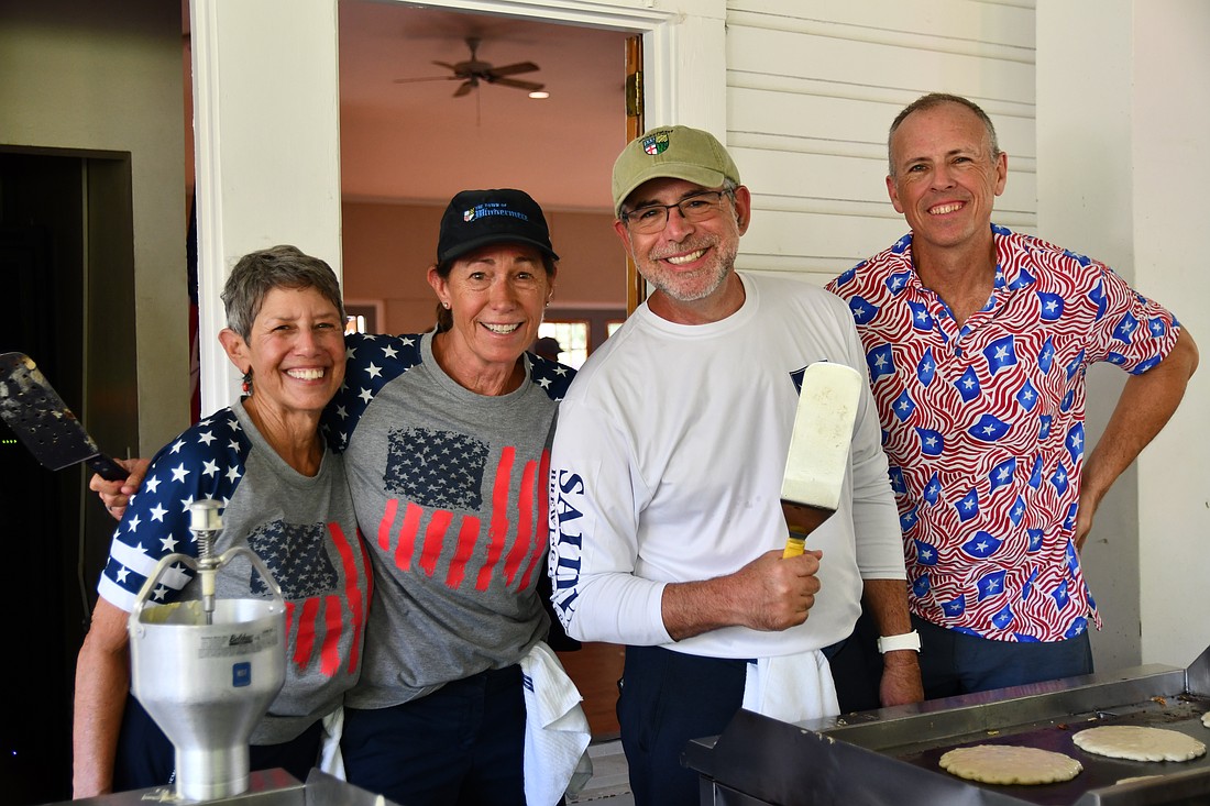 Molly Rose, Windermere Town Council member CT Allen, Mayor Andy Williams and Chris Andert worked hard to make sure there was no shortage of pancakes for all to enjoy.