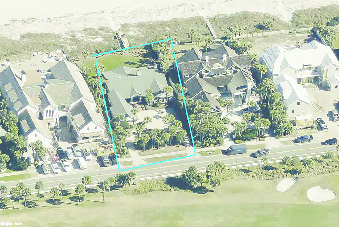 Oceanfront single-story home with golf views features three bedrooms, four bathrooms, patio, porches, outdoor kitchen and dune walkover.