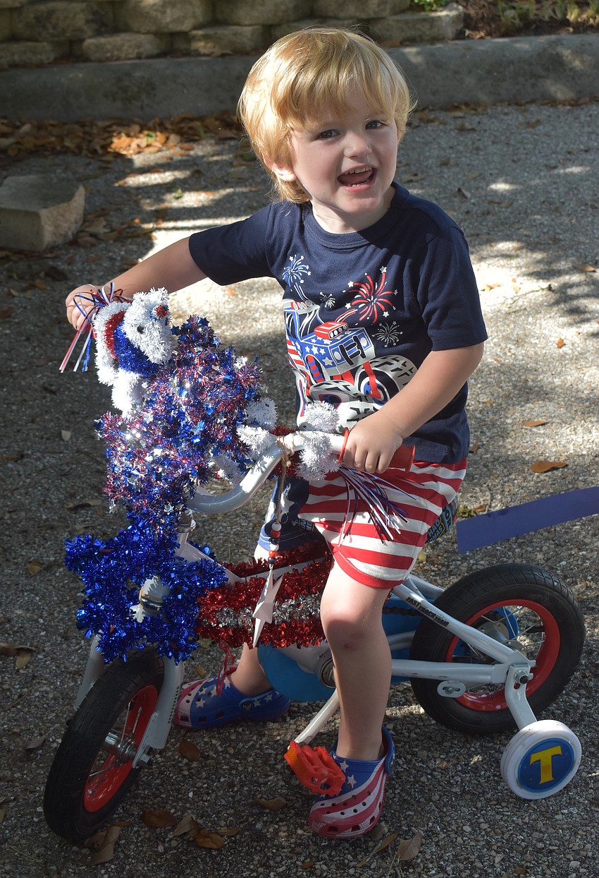Bobby Stacey, 3, decided to show his patriotism during the bike parade.