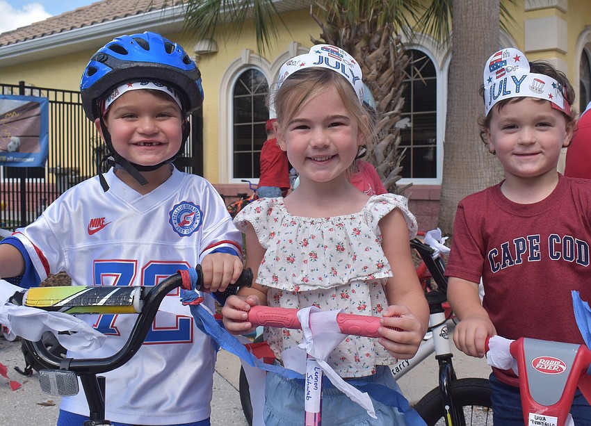 Three-year-olds Ryden Rees, Lennon Schwab and Jameson Stone are happy to come together to celebrate Independence Day with their friends at Kiddie Academy of Lakewood Ranch.