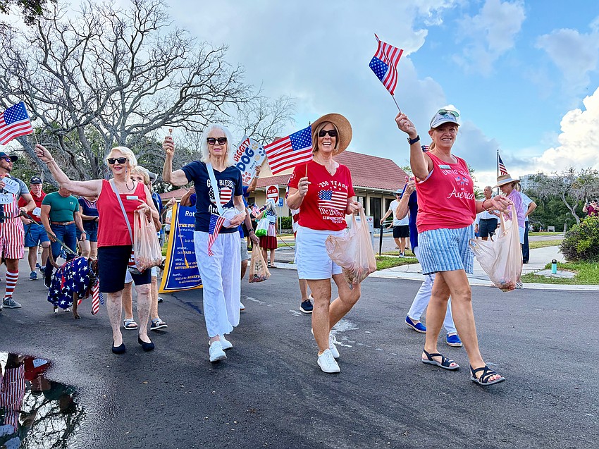 Members of the Longboat Key Garden Club, including President Melanie Dale, lead their group in the Freedom Fest parade on July 4 along Bay Isles Road. Along with the Longboat Key Chamber of Commerce, the club is one of the main organizers of the patriotic celebration, particularly for the butterfly release.