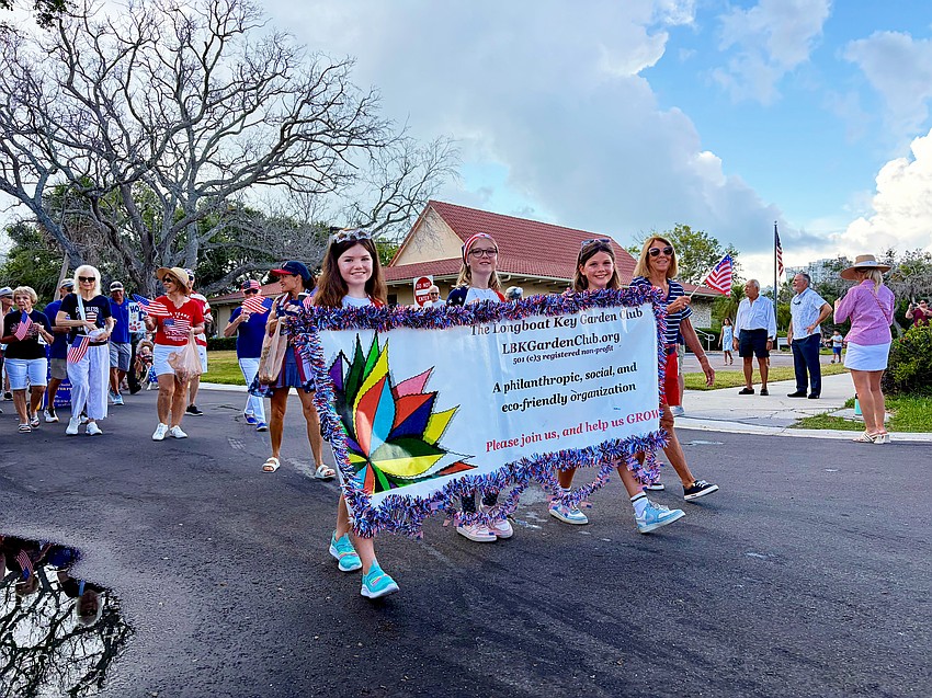 Representatives of the Longboat Key Garden Club start their march at Freedom Fest.