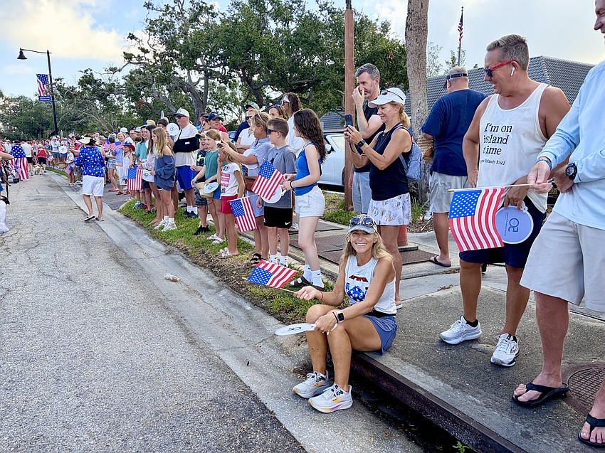 Parade fans lined both sides of Bay Isles Road for the 'World's Shortest Parade' on Longboat Key. In those few blocks, marches packed in plenty of patriotic fun while throwing treats and bracelets to onlookers.