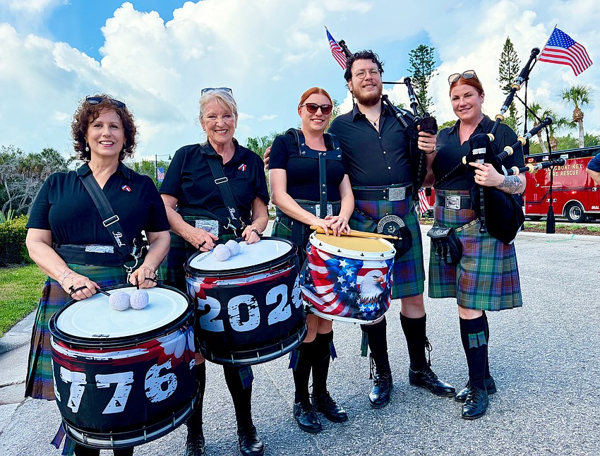 Mary Hutchinson, Deborah Houston, Courtney Calo, James Dennis and Director Cassandra Calo of Blue Skye Pipes and Drums on July 4.