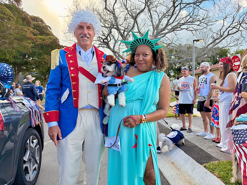 Michael and Medge Jaspan dress to impress at Freedom Fest, winning the best combination costume with their dog, Bisou.