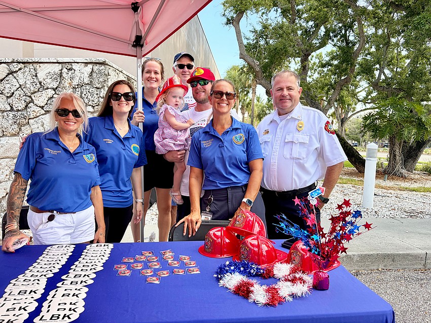 Town of Longboat Key officials welcome visitors to Bicentennial Park after the Fourth of July parade.