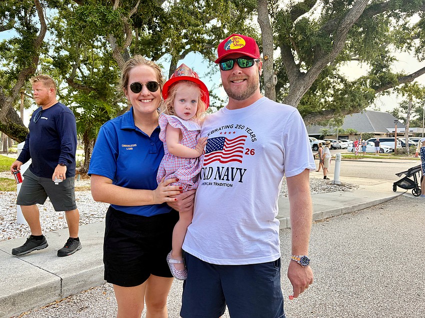 Savannah, Aaron and nearly 2.5-year-old Charlotte Cobb dive into the Fourth of July fun at Freedom Fest.