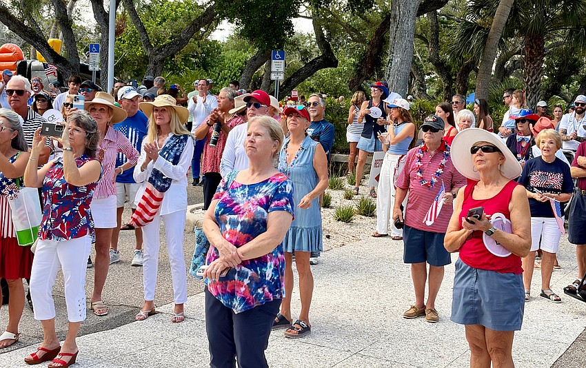 Onlookers gather to witness the rededication of Bicentennial Park in honor of the country's 250th anniversary.
