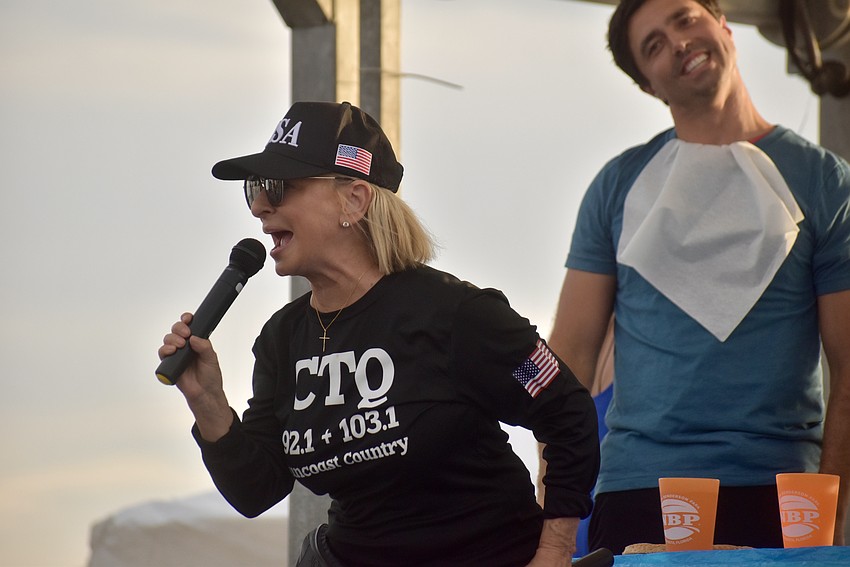 During the apple pie eating contest, Lulu with 92.1 CTQ gets the crowd to chant, 