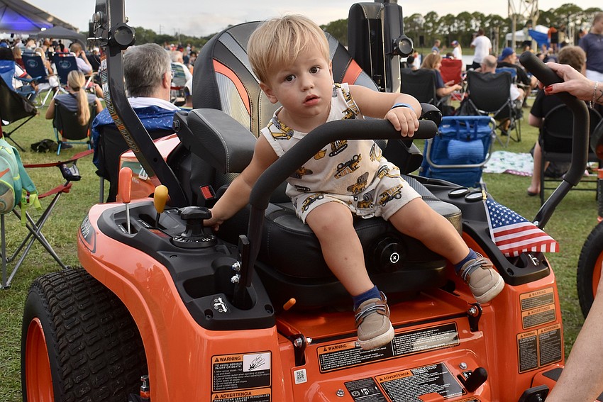 Sarasota's 2-year-old Ram Elliott checks out a tractor.