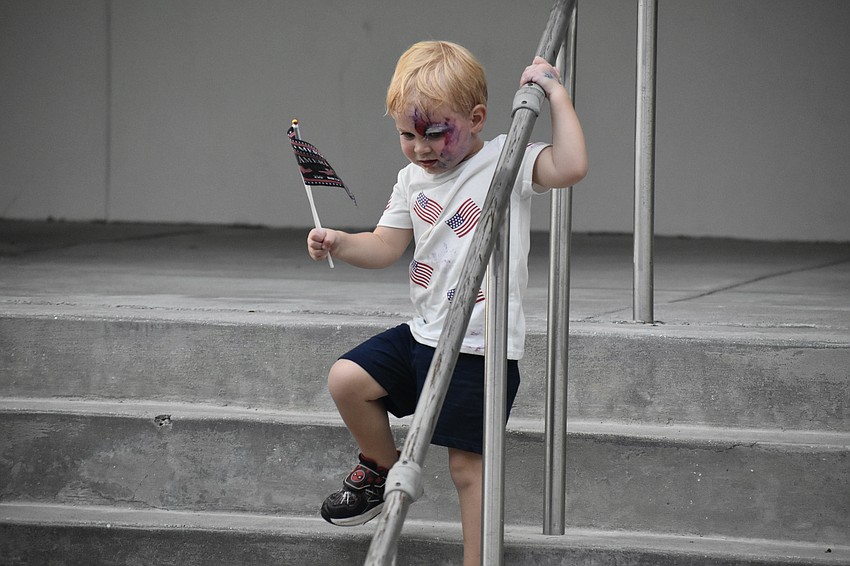 Mason Wilson, 2, plays on the steps of the Selby Library.