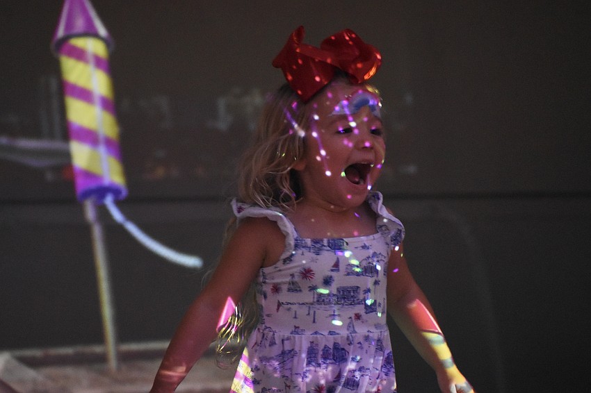 Carmela Barak, 3, finishes a round of 