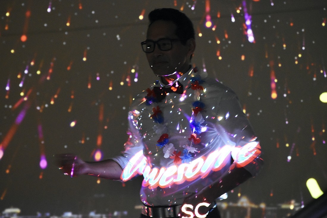 Frankie Del Rosario of The ProMedia Group, which assisted with the projectors for the display, shows that he's "awesome" at setting off the fireworks.