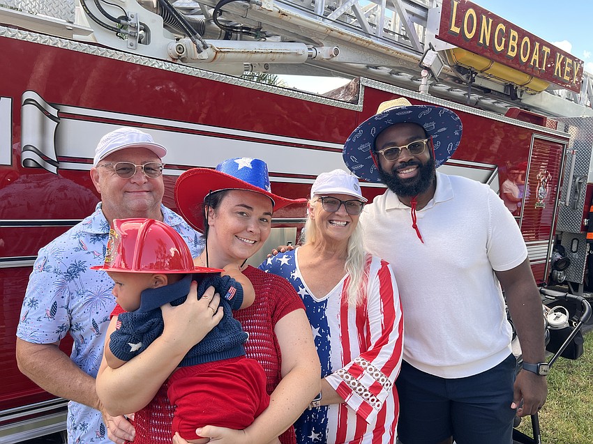 Scott Seabaugh, Roman Rendell, Sydney Rendell, Marci Seabaugh and Jean Rendell enjoy the festivities after the parade.