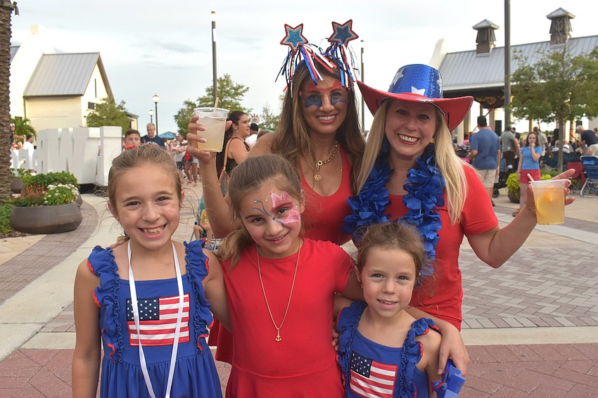Back row, Kate Tully and Michelle Halbman, attend the Star Spangled Spectacular at Waterside Place with their kids Hadley Halbman, 9, Olivia Tully, 9, and Lucy Halbman, 5.