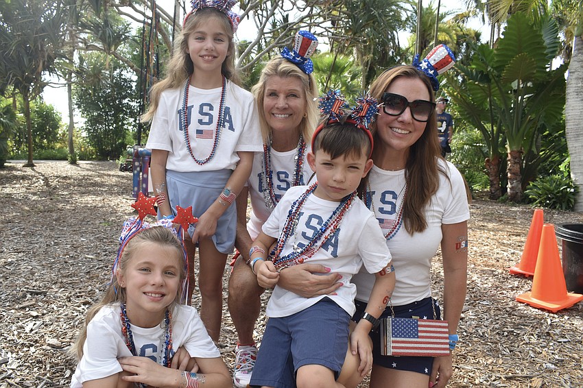 Molly Biter (right) and her daughters Maya Biter, 9, Ellie Biter, 9, aunt Katie Moulton and son Leo Biter, 5, enjoy the event.