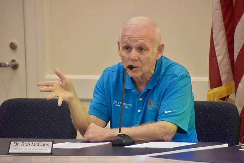 Commissioner Bob McCann answers questions from Lakewood Ranch CDD board members June 30 at Town Hall.