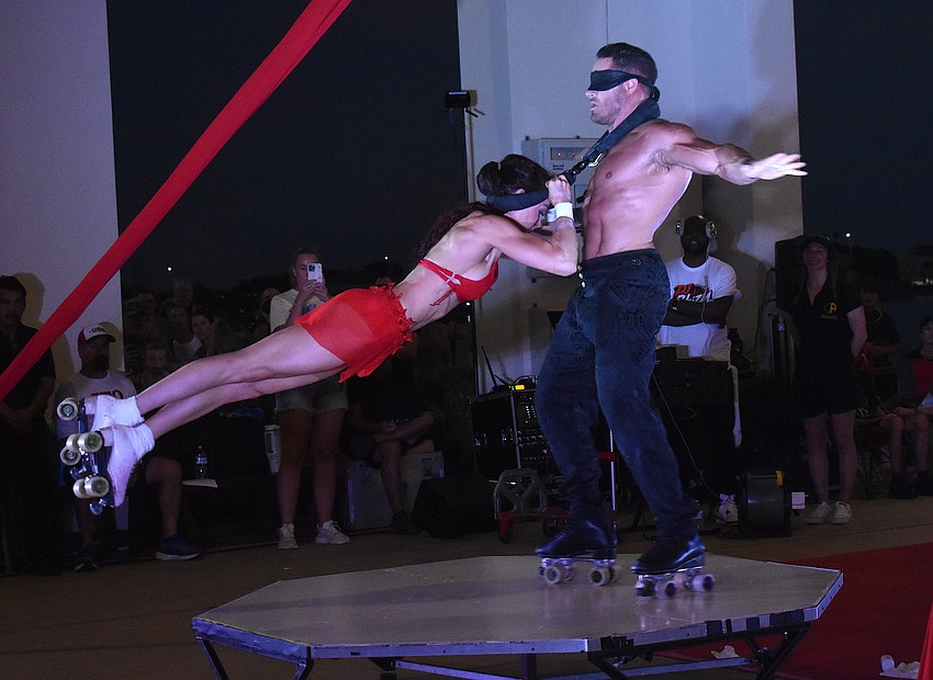 Duo Transcend's Mary Wolfe-Nielsen and Tyce Nielsen, who were finalists on Season 13 of America's Got Talent, perform at the Star-Spangled Spectacular at Waterside Place with the Circus Arts Conservatory.