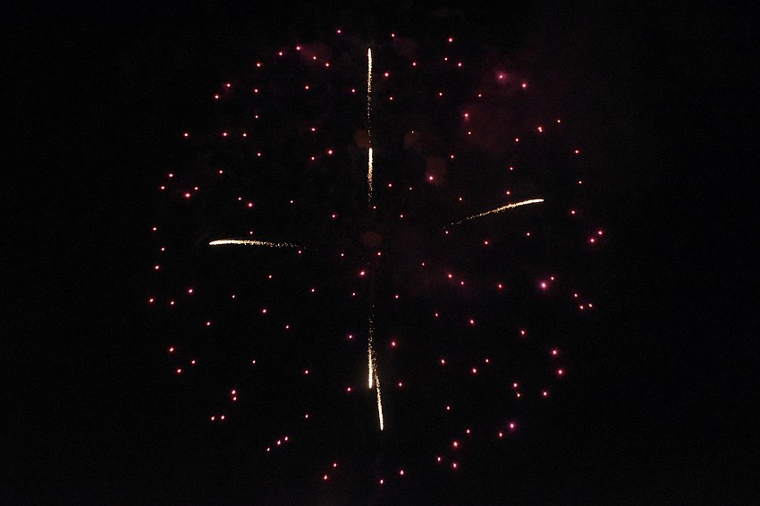 Fireworks burst over Siesta Key Beach.