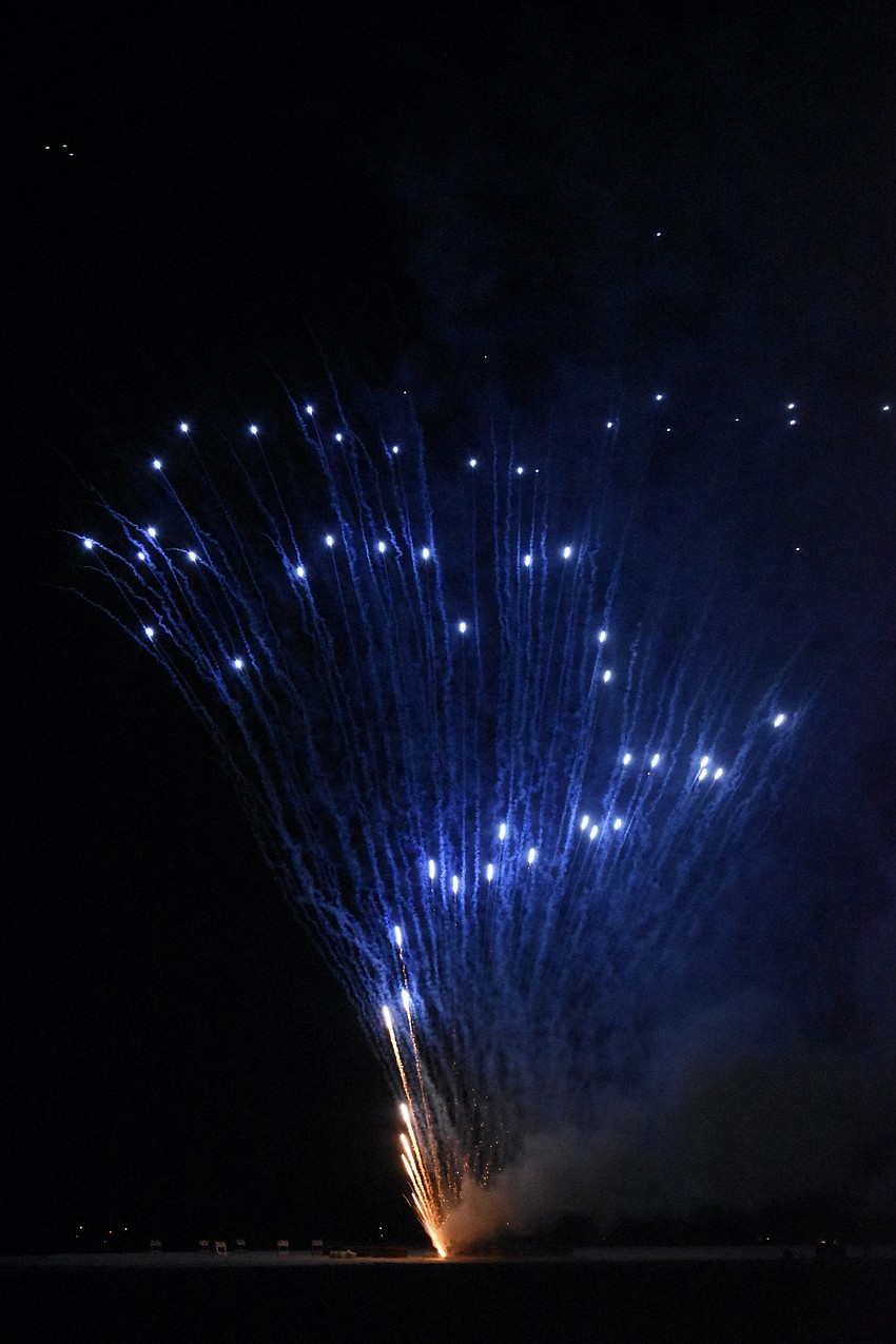 A zigzagging series of fireworks is dispensed.