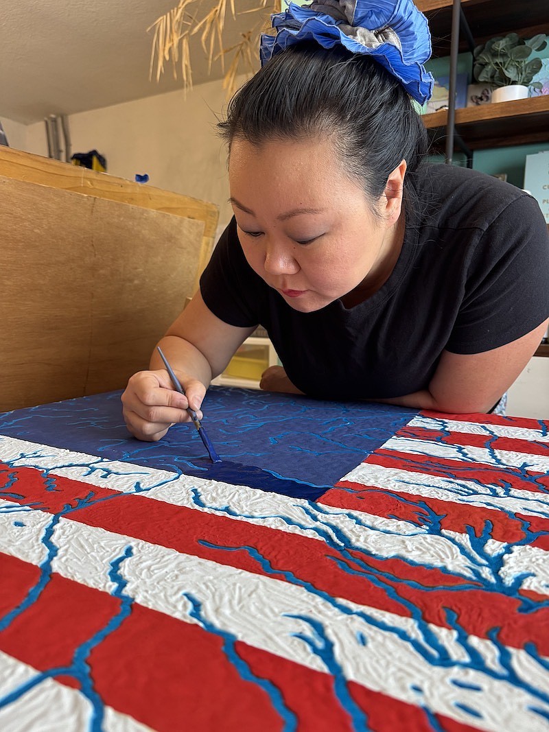 Jing Herman works on “American Rivers. Jing Herman works on “American Rivers.