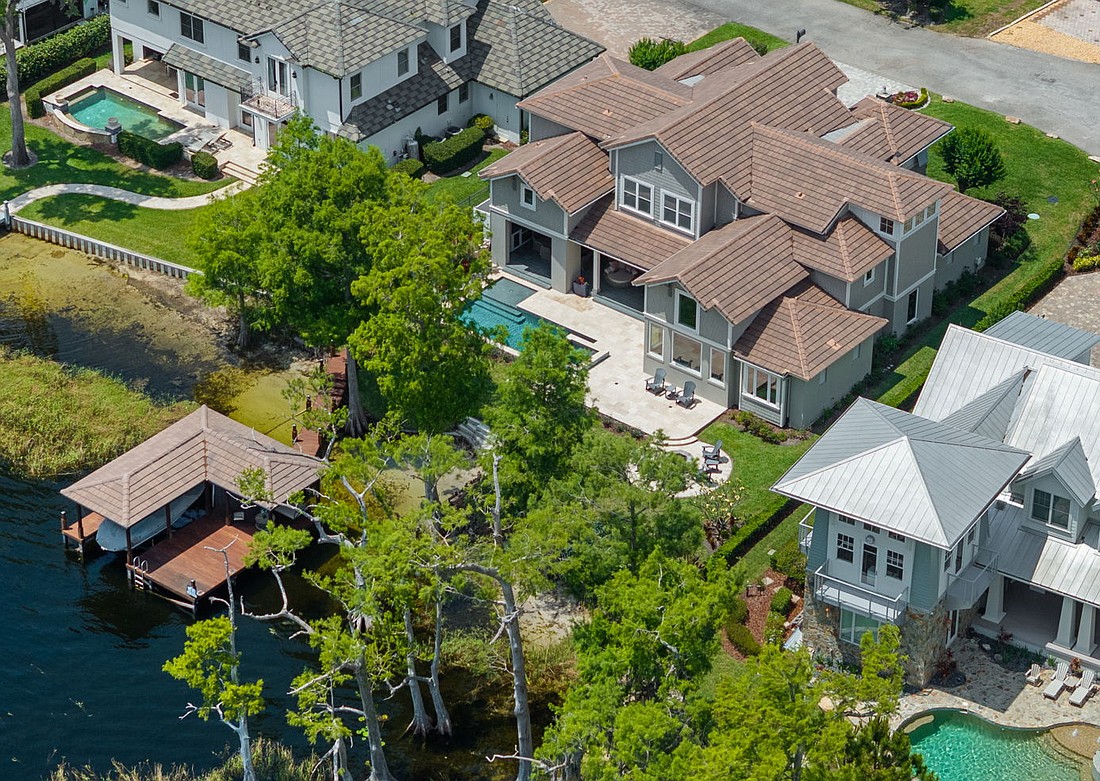 The home at 9916 Lone Tree Lane, Orlando, sold July 1, for $3,800,000. Situated near the tip of a peninsula lot, the home features views of Lake Tibet, Lake Sheen and the connecting canal from nearly every room. The sellers were represented by Chad Going, SERHANT.