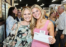 Scholarship recipient Julianne Teague celebrates with her mother, Trudy
Teague, at The Exchange’s 2026 Grants and Scholarship Awards event.