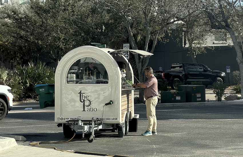 The Patio coffee cart serves a customer. The mobile vendor was unknowingly illegally operating in Sarasota's Downtown Bayfront zone district. The Patio coffee cart serves a customer. The mobile vendor was unknowingly illegally operating in Sarasota's Downtown Bayfront zone district.