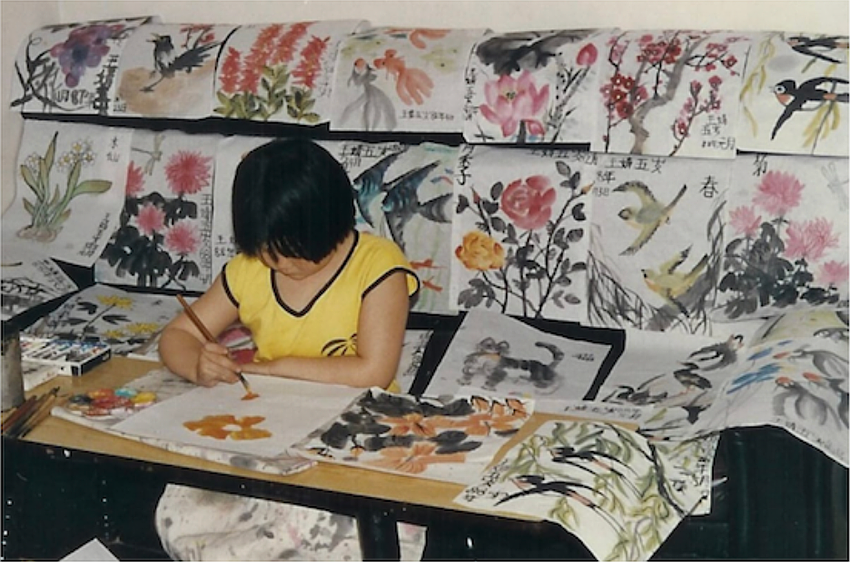 Jing Herman is surrounded by her Chinese watercolor paintings at age 6 in Beijing. Jing Herman is surrounded by her Chinese watercolor paintings at age 6 in Beijing.